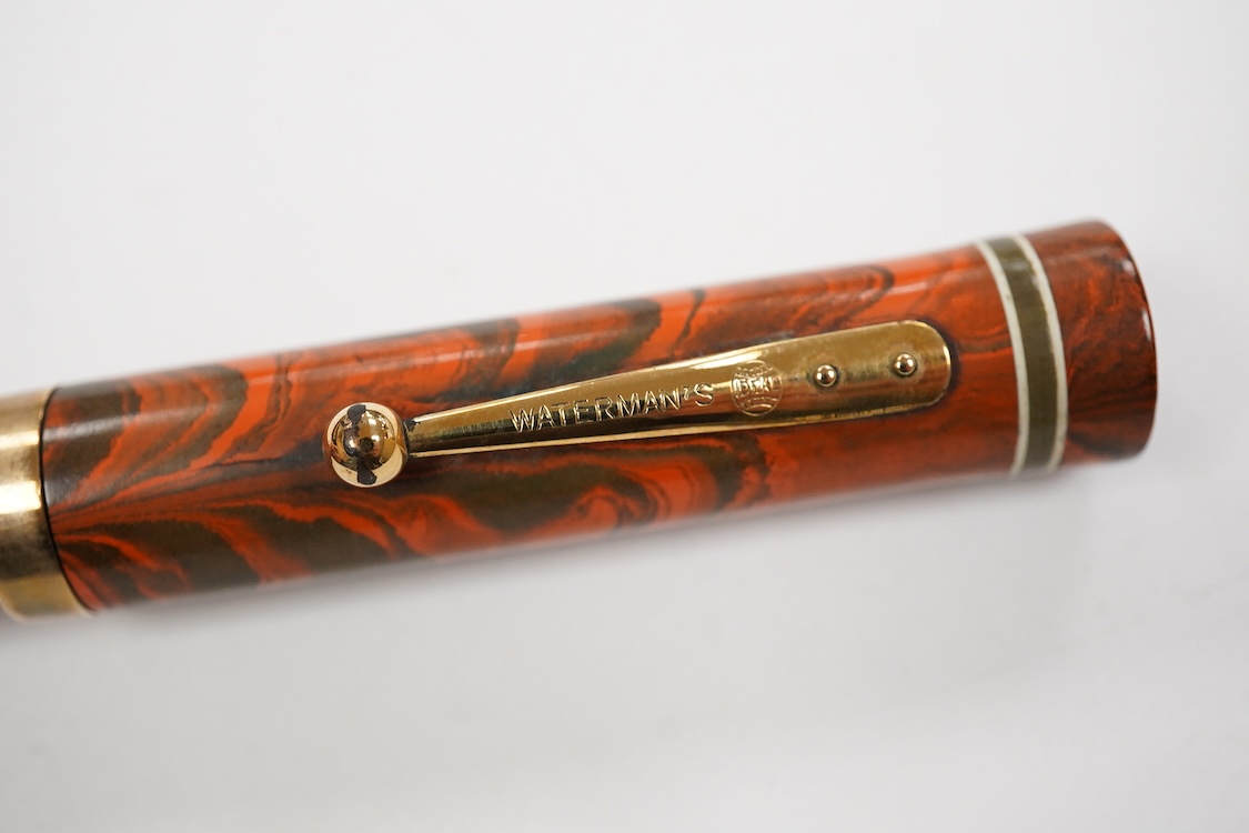A Waterman Red Ripple No. 5 lever filler with green cap band and fitted with No. 5 Waterman nib